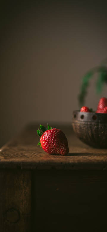 Strawberry on a wooden table phone wallpaper