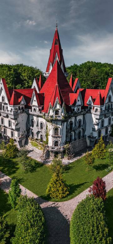 Fantasy castle surrounded by green trees