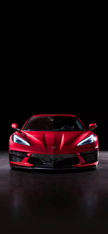 Red supercar on black background