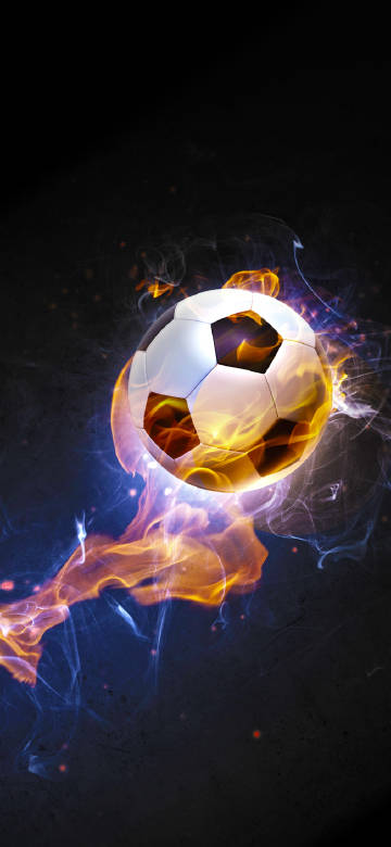 Burning soccer ball on dark background