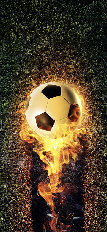 Football with flames on the grass